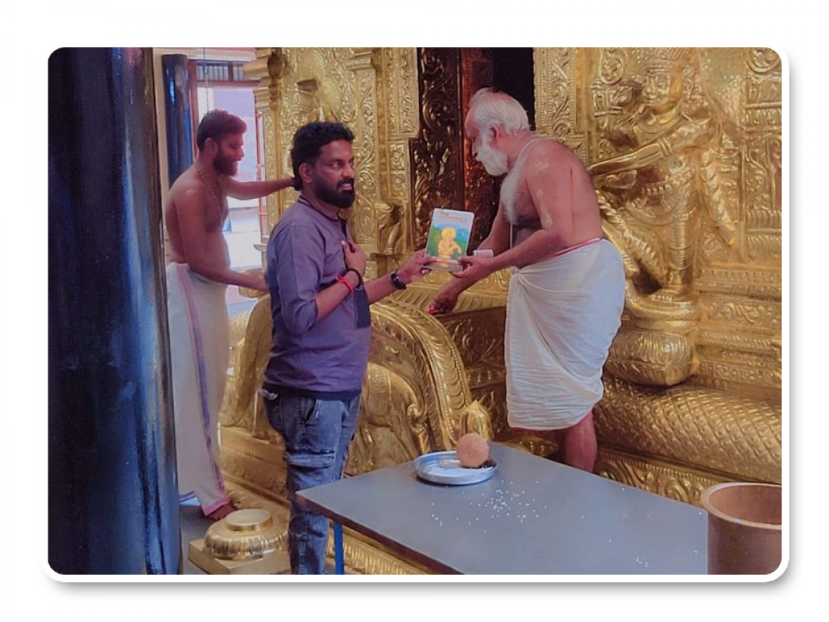 Presenting Integral books to Rishikesan Namboothiri (RK Puram Ayyappa Swami Temple New Delhi)