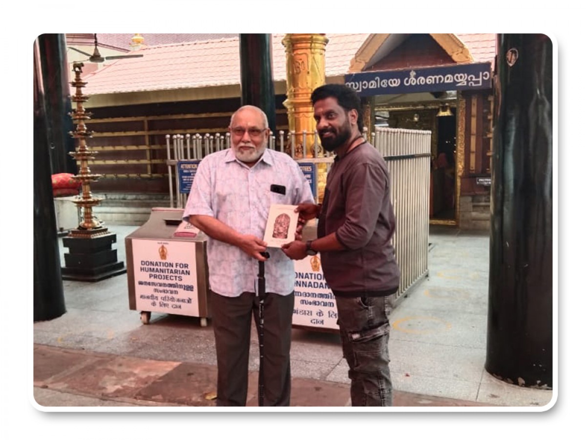 Presenting Integral books to K P Menon (Rtr. Prasident - RK Puram Ayyappa Swami Temple New Delhi)