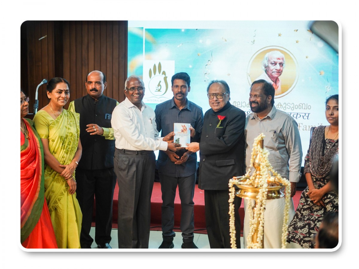 Presenting Integral books to Justice Dr. K Narayana Kurup